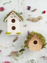 Bird houses decorated with moss.