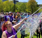 Bubbles swirling around men and women.