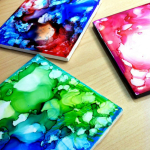 Watercolor effect on  white tile coasters.