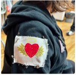 Handmade patch pinned to a shirt