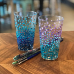 Pint glasses decorated with blue and purple dot design