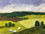 Needle felted spring landscape with hills and sheep