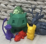 A collection of 3D printed figures in multiple colors