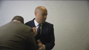 Jon Tester and Cory Booker breaking drywall