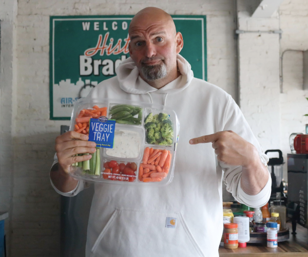 John Fetterman holding a veggie tray
