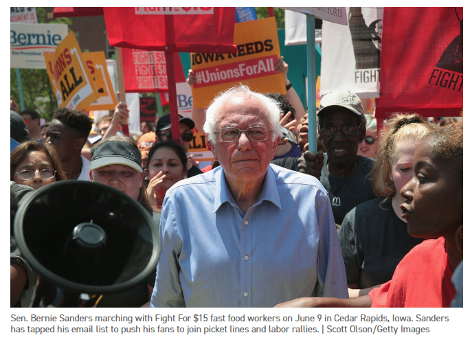 Bernie Sanders marching with Fight for $15 fast food workers on June 9 in Cedar Rapids, IA.