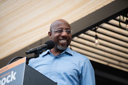 Image of Senator Raphael Warnock smiling