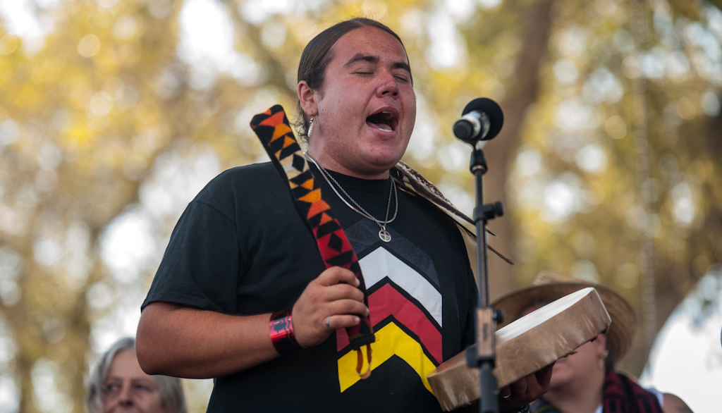 Greg Grey Cloud sings onstage at Harvest the Hope