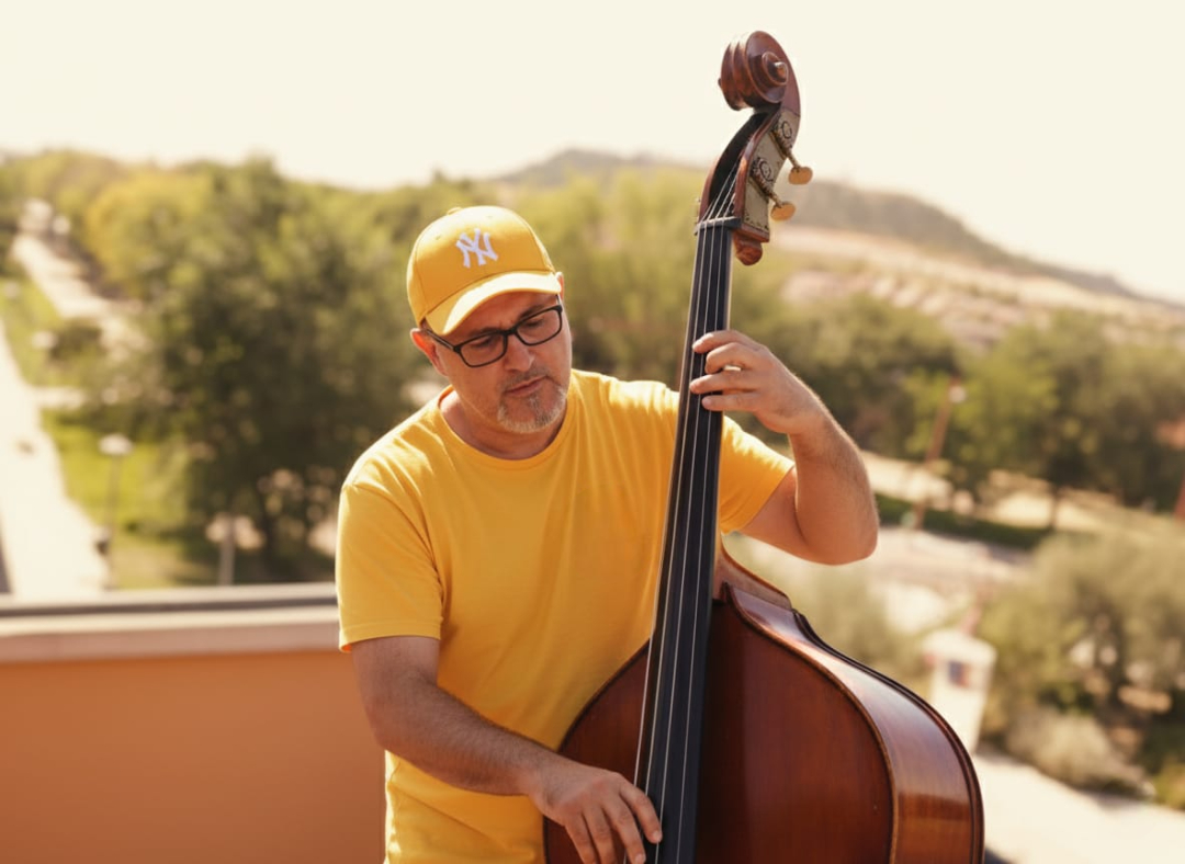 Nacho Valenciaga playing double bass outdoors — jazz photo by Nacho Valenciaga | All About Jazz