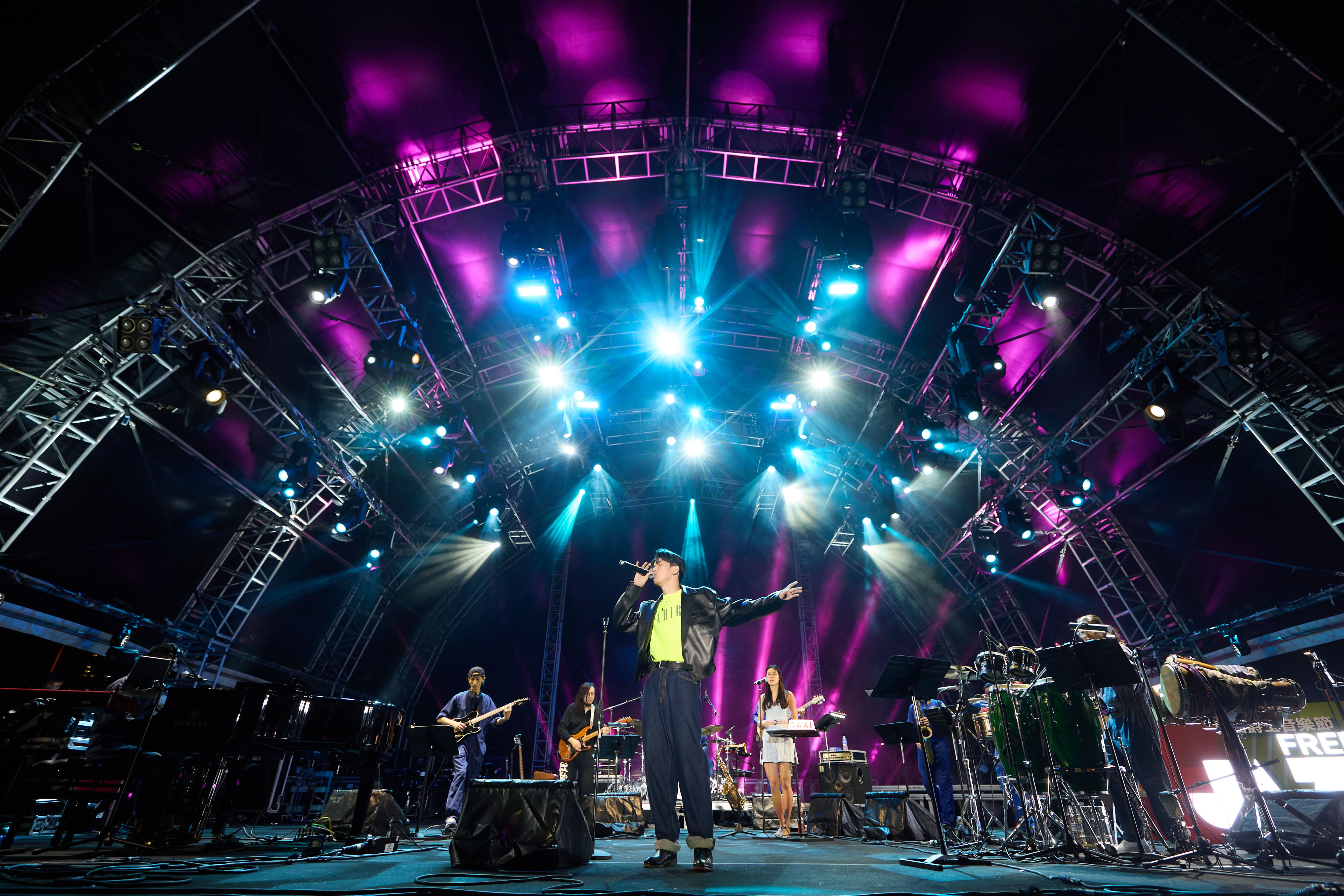 Cantopop star Phil Lam on stage with Good Funk Shui at Hong Kong's Freespace Jazz Festival 2022