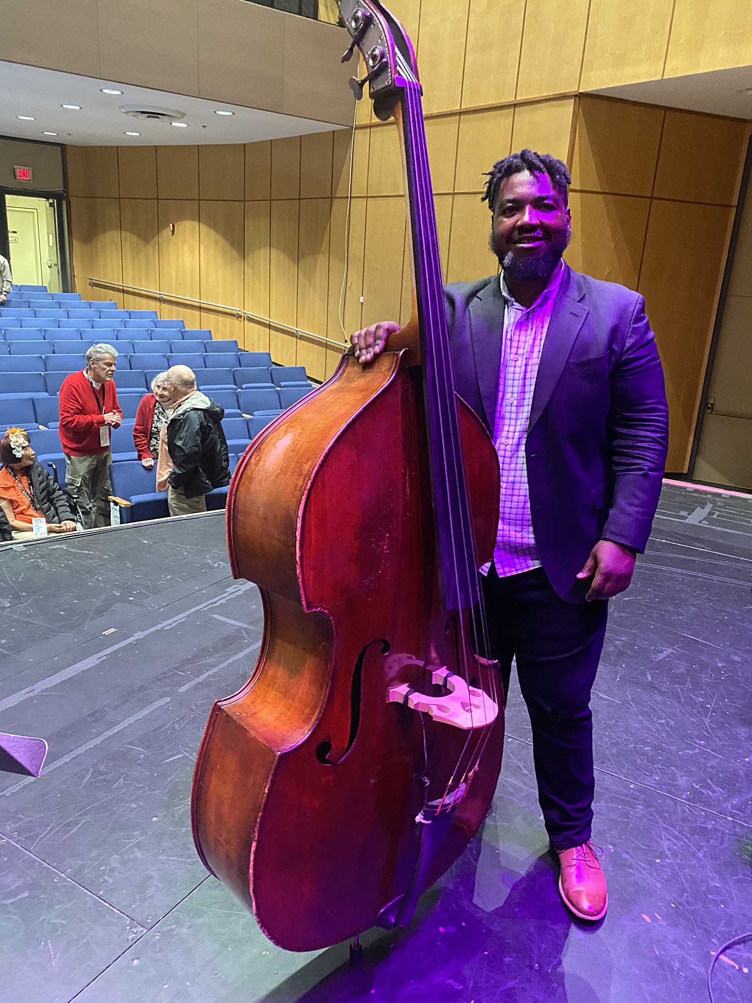 Dezron Douglas with Dave Holland's bass at The Rochester Jazz Festival — jazz photo by Michael Ricci | All About Jazz