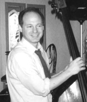 A young Greg Nathan with his String Bass