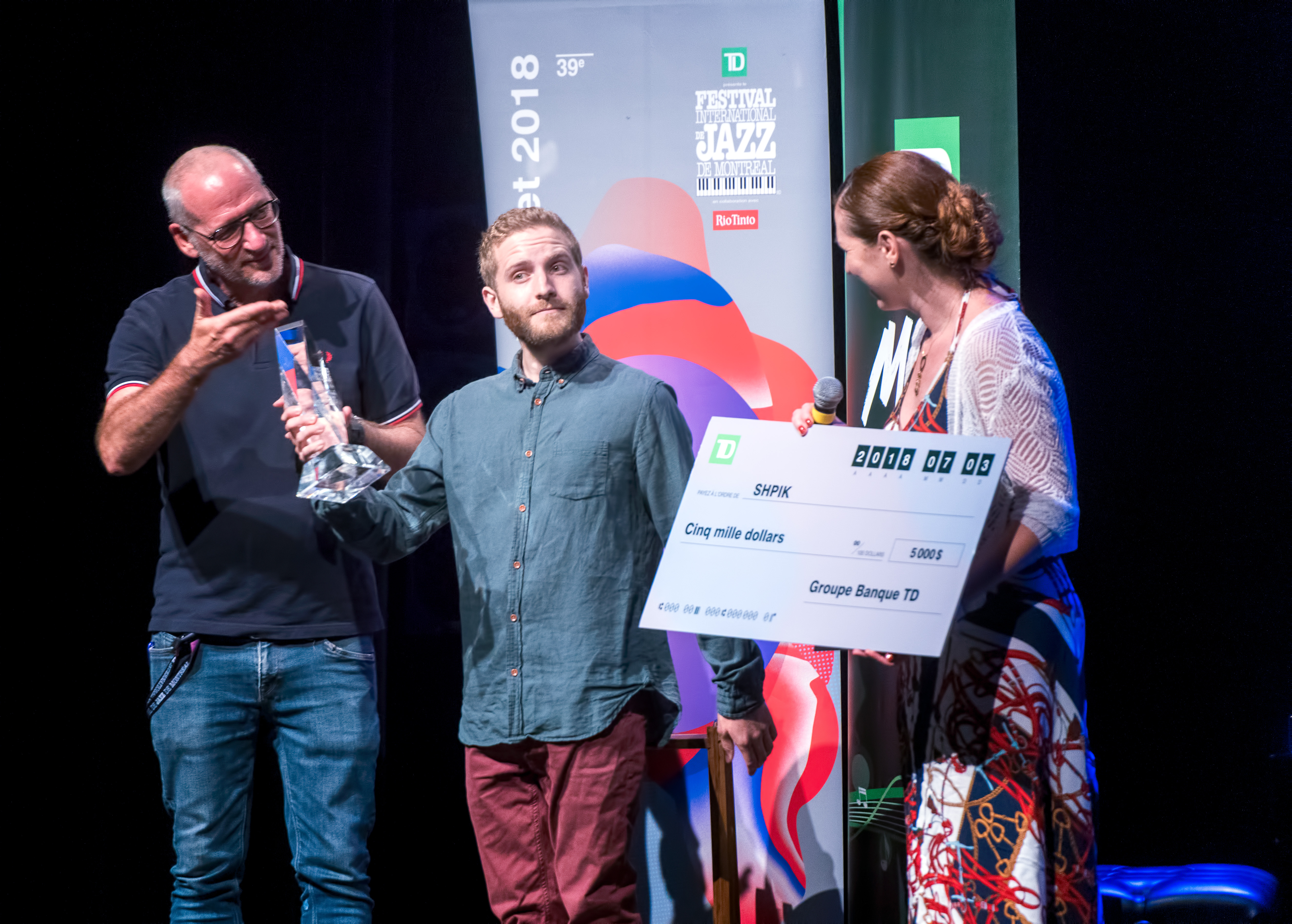 Arnaud Spick Saucier receiving the TD Jazz Competition Award on behalf of SHPIK at The Montreal International Jazz Festival 2018