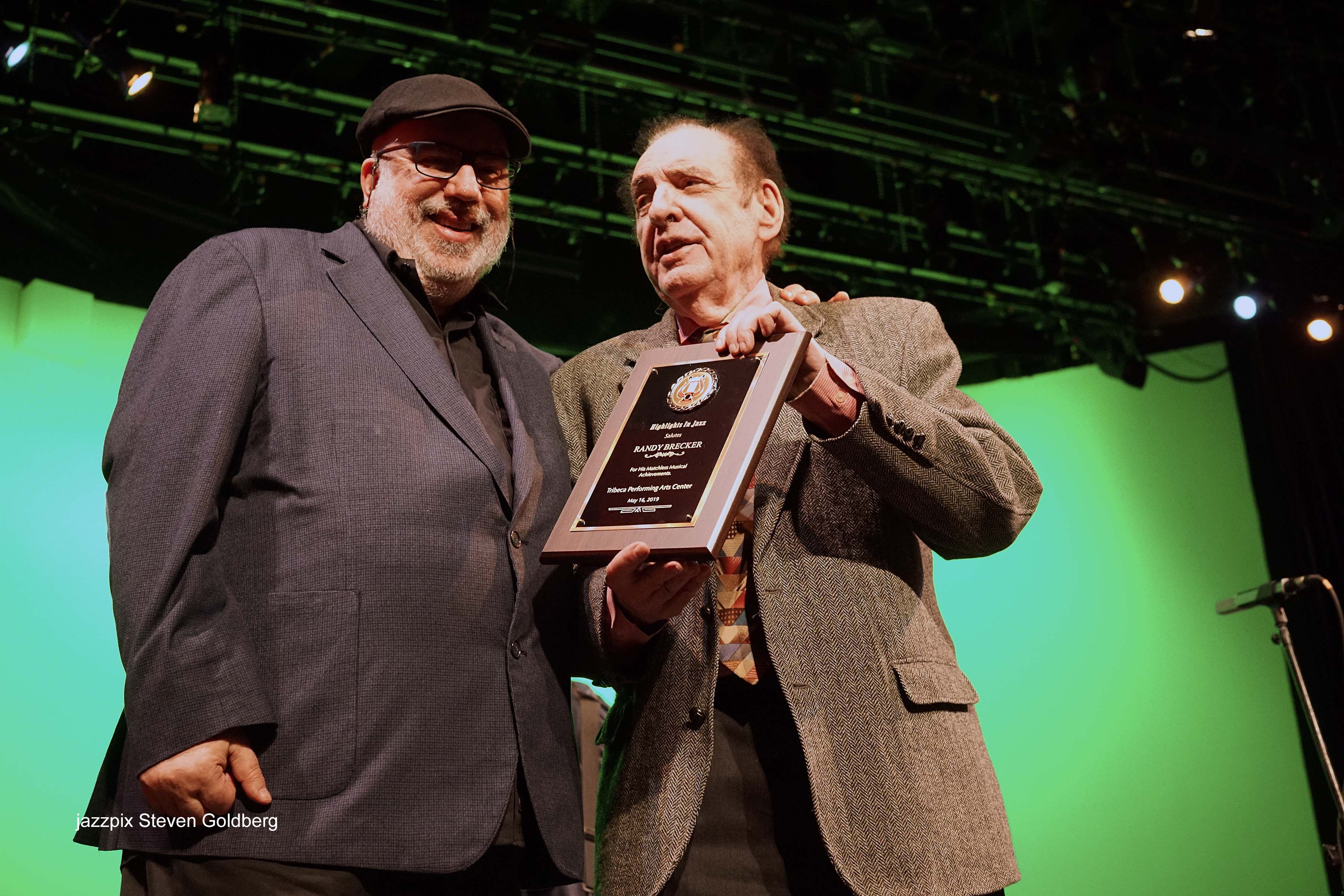 Randy Brecker receiving award from Jack Kleinsinger