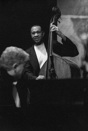 Bassist John Clayton Solos as Monte Alexander Looks on During Their Tribute to Ray Brown, December 2002.