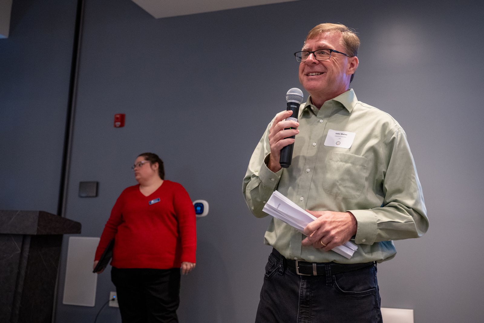 A speaker addressing township leaders with a microphone