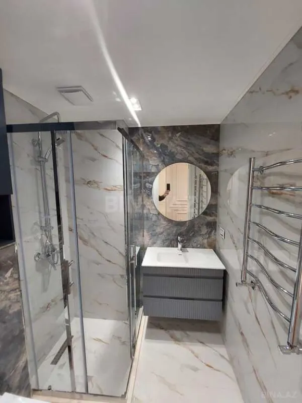 Satılır 4 otaqlı mənzil 154 m²