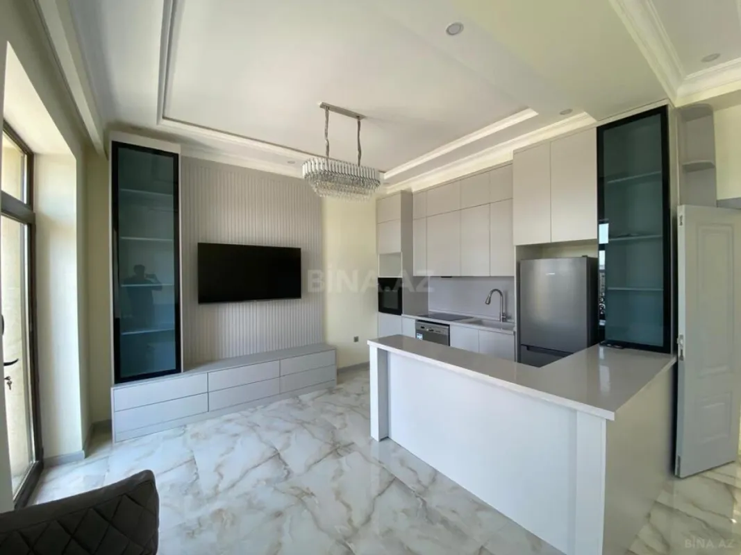 Satılır 4 otaqlı mənzil 121 m²