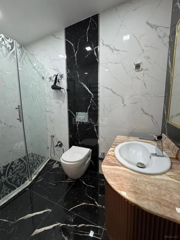 Satılır 4 otaqlı mənzil 230 m²