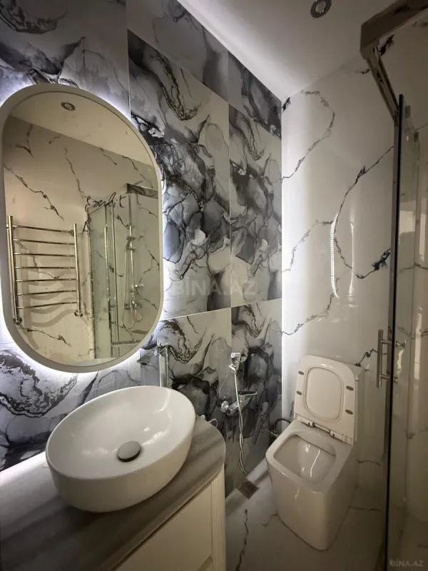 Satılır 4 otaqlı mənzil 144 m²