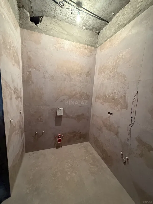 Satılır 4 otaqlı mənzil 163 m²