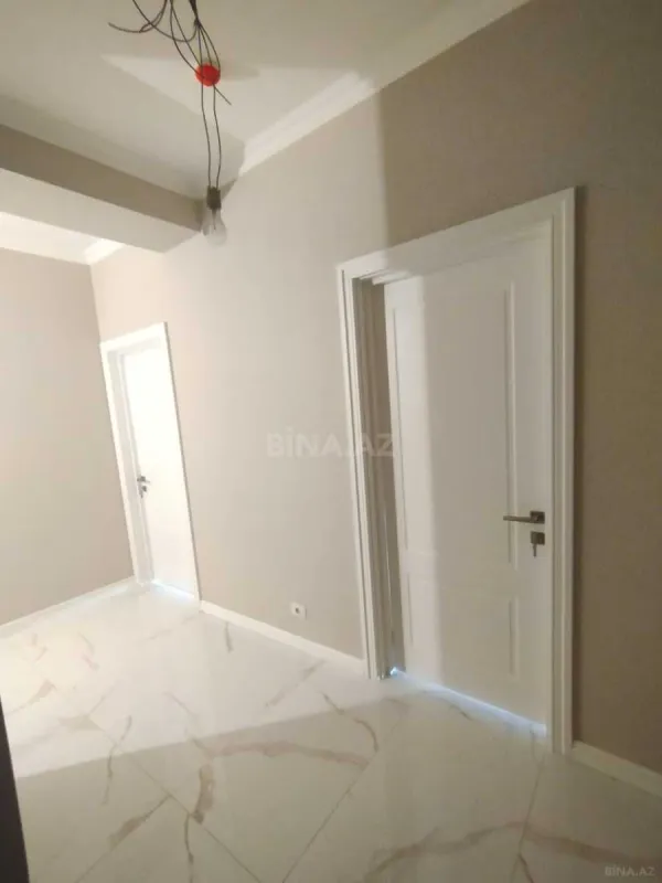 Satılır 4 otaqlı mənzil 122 m²