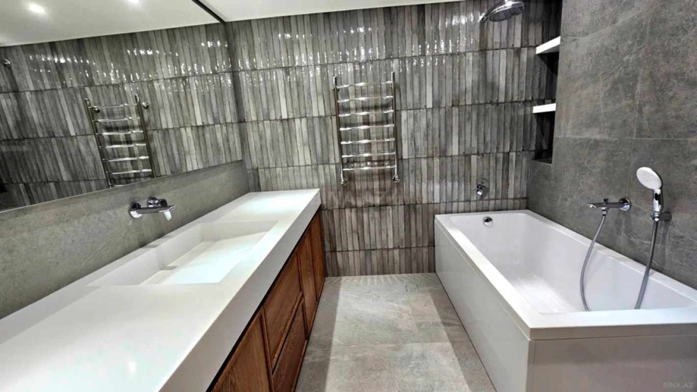 Satılır 4 otaqlı mənzil 164 m²