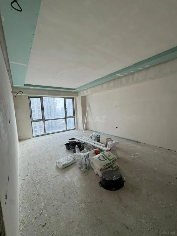 Satılır 4 otaqlı mənzil 128.9 m²