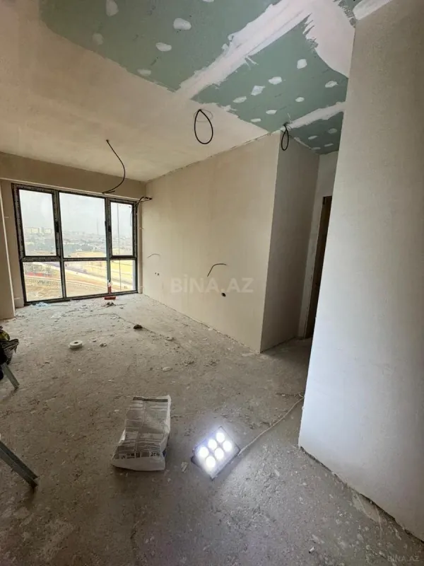 Satılır 4 otaqlı mənzil 128.9 m²