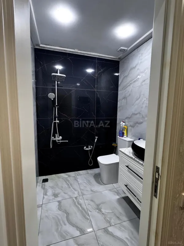 Satılır 4 otaqlı mənzil 128 m²