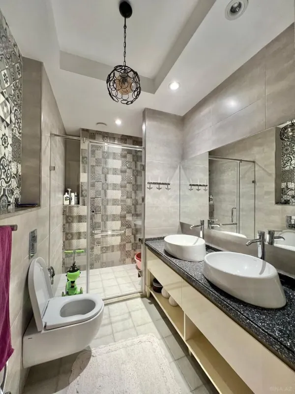 Satılır 4 otaqlı mənzil 154 m²