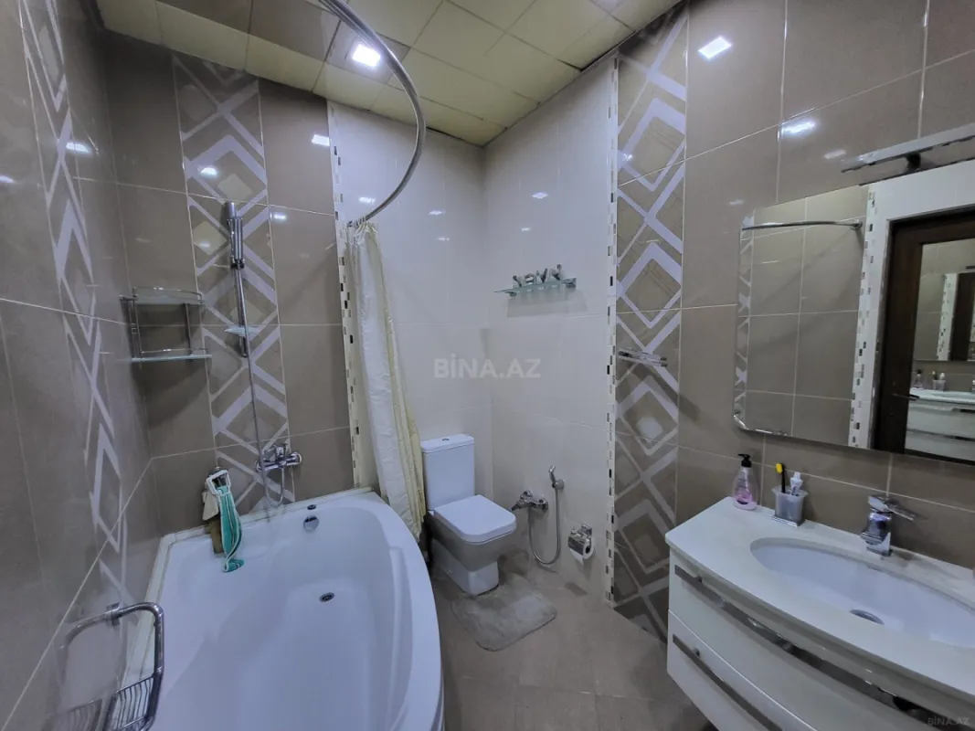 Satılır 4 otaqlı mənzil 164 m²