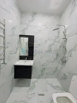 Satılır 4 otaqlı mənzil 142 m²