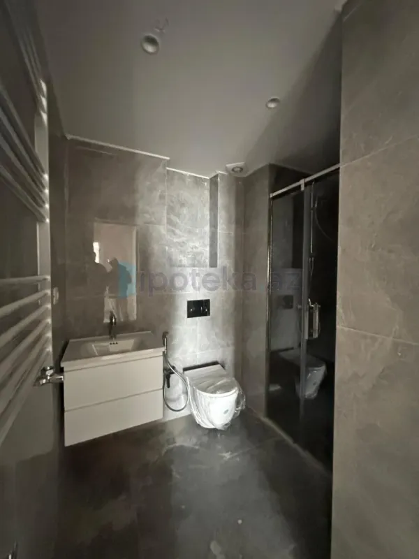 Satılır 2 otaqlı yeni tikili 63.99 m²