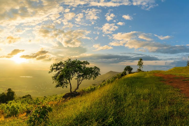 Mountain landscape with colorful vivid sunset on the cloudy sk