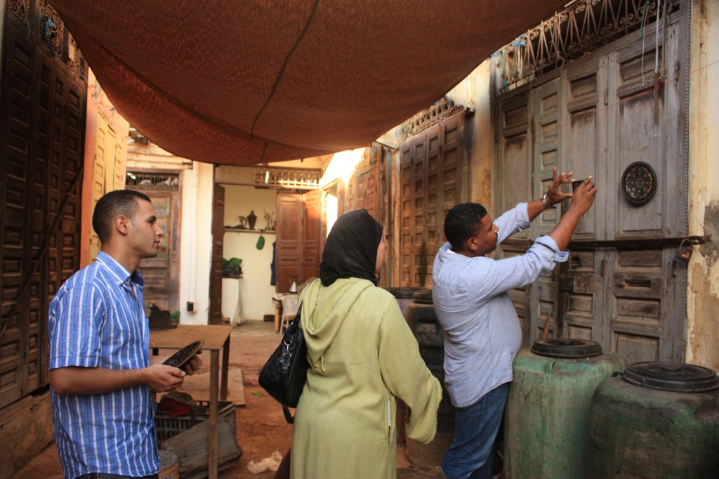 Rabha and Omar help Hicham learn the basics of photography on Anou.