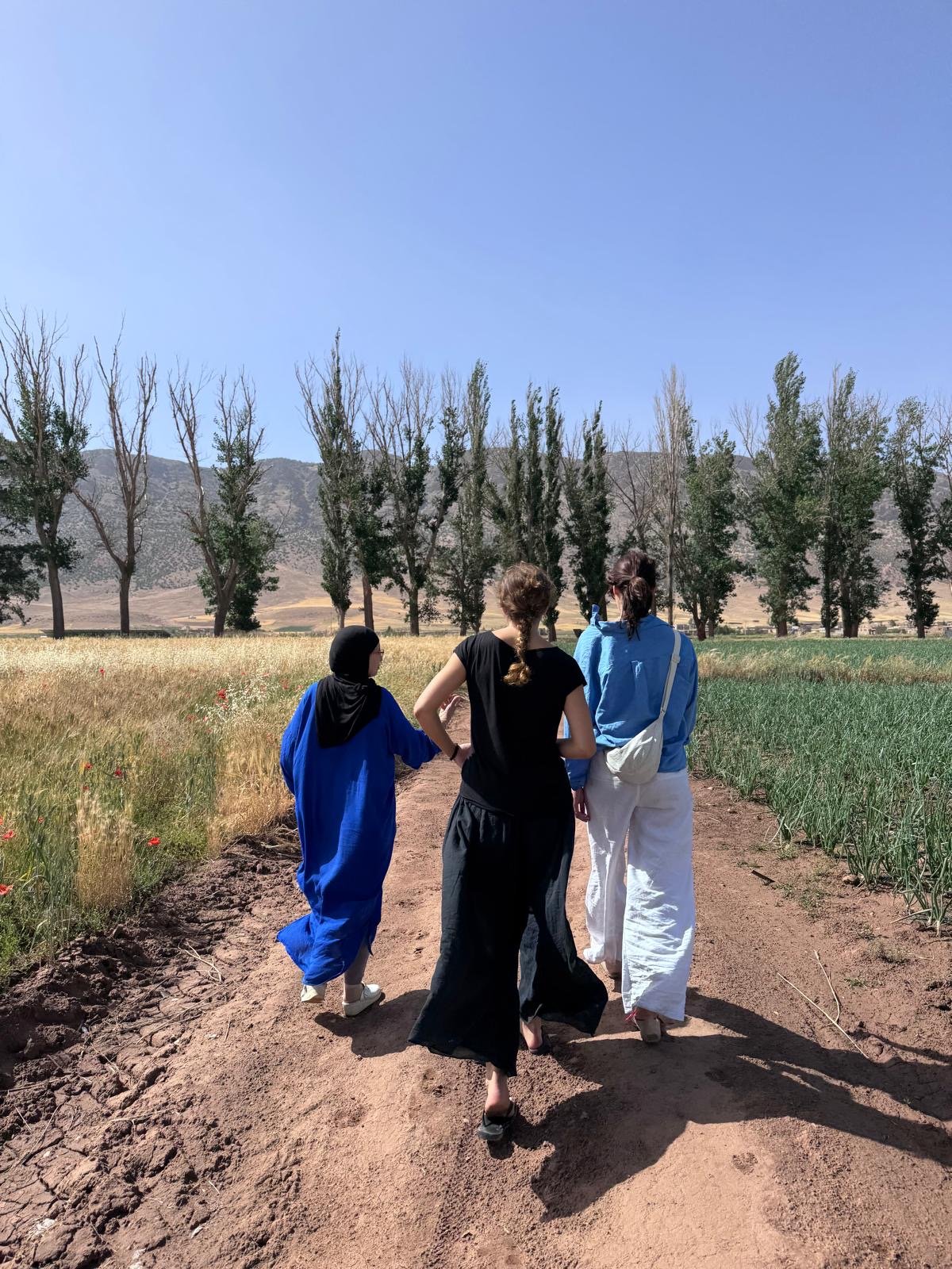 Walking through the fields near Association Tithrite with a member of the group