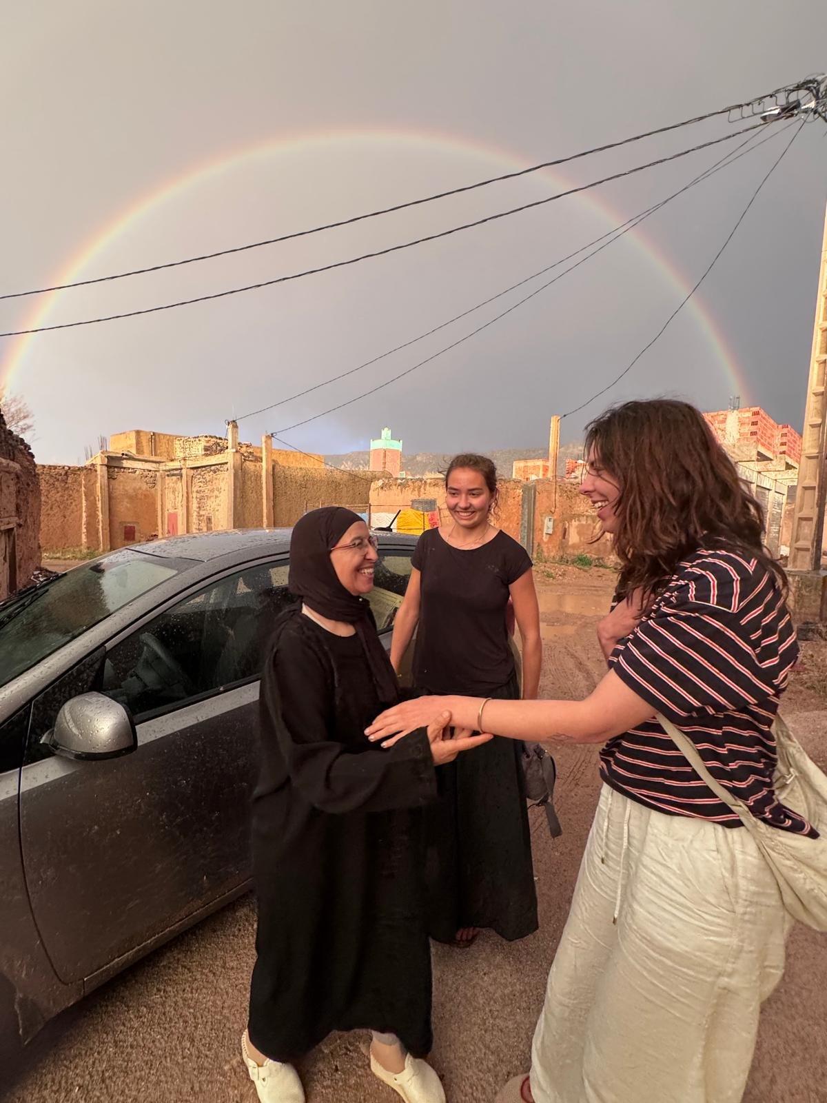 Saying goodbye at Association Tithrite under a rainbow