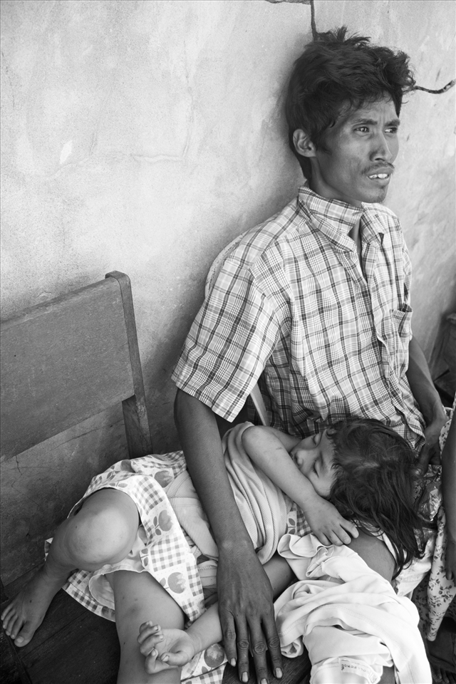 Municipal hospital is prioritizing cases that need immediate attention.  This father is waiting to hitch a ride to bring sick daughter to Davao Medical Center -- a 7 hour ride from the province to the city.