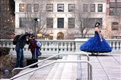 A girl twirls, posing for a photo to commemorate her quinceañera; Air Jordans peak out from below her ball gown. The stark contrast between shoes and dress mirrors the dichotomy between girl and city. Tradition holds on even as commerciality threatens to overwhelm it.: by 2_peacemaker, Views[1593]