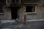A Free Syrian Army fighter took a shower outdoors to beat the heat : by 360daysinawarzone, Views[536]