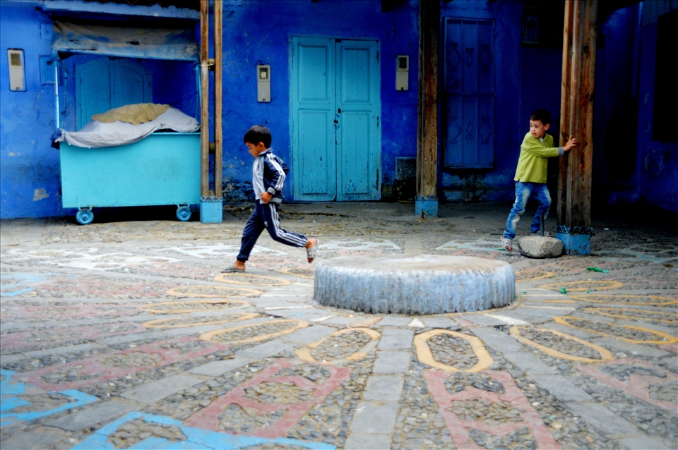 Fun in the Medina:Two children are playing in a square of Chefchaouen's Medina