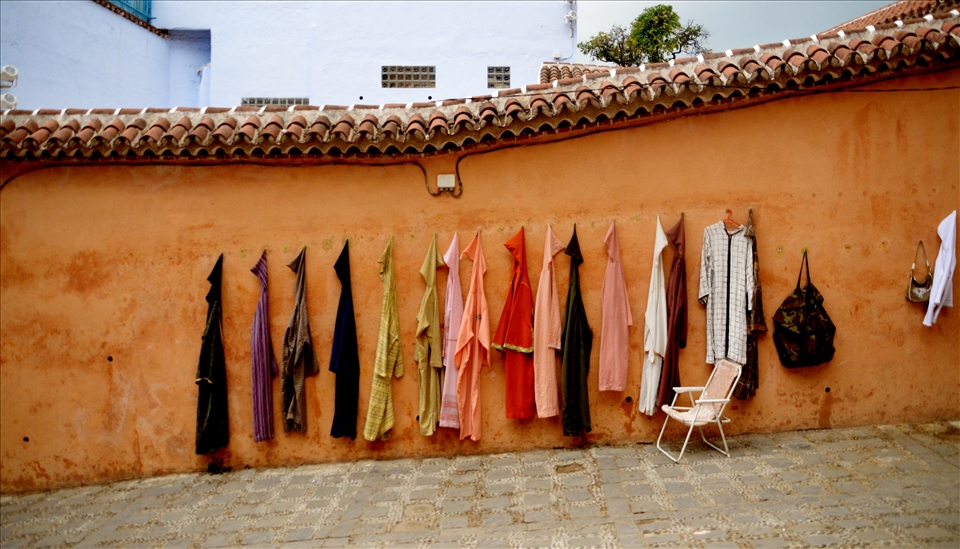 Work in the Medina: a wall of typicals moroccans dresses 