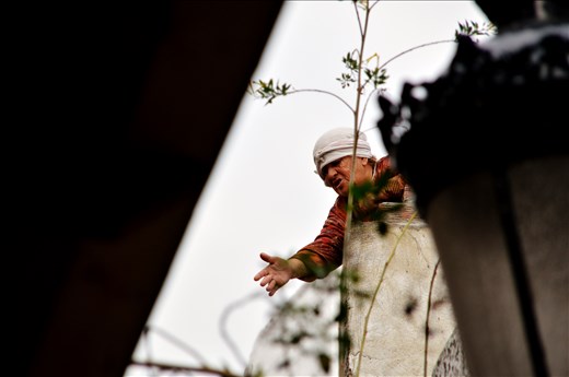 Communication in the Medina: an old woman is calling her family from a terrace