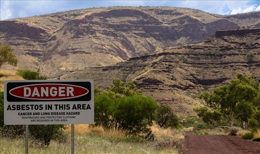 The entrance to Wittenoom Gorge has many warning signs about the danger that lies ahead.