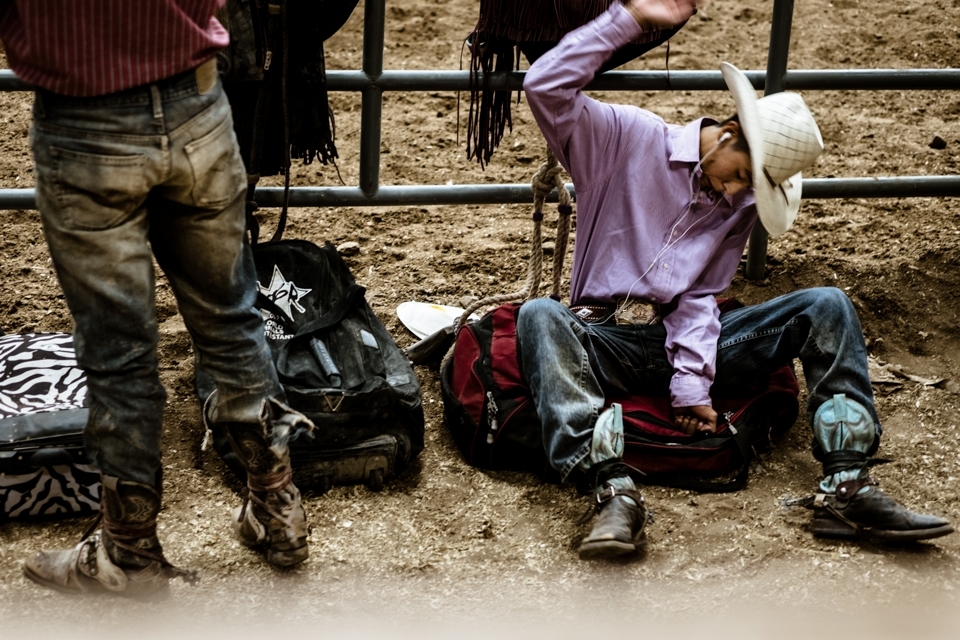 A young hopeful practices his bronc riding technique next to the main arena at the International Indian Finals Rodeo at the Albuquerque State Fair in New Mexico.