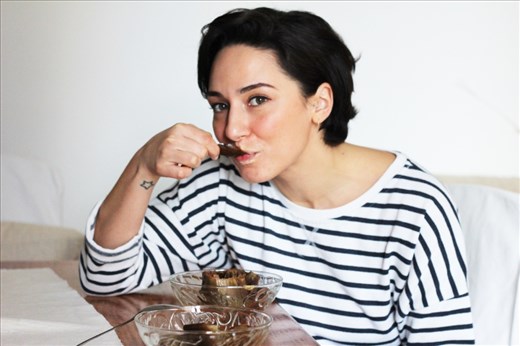 Enjoying the process of eating an artichoke, eagerly anticipating the tender heart.