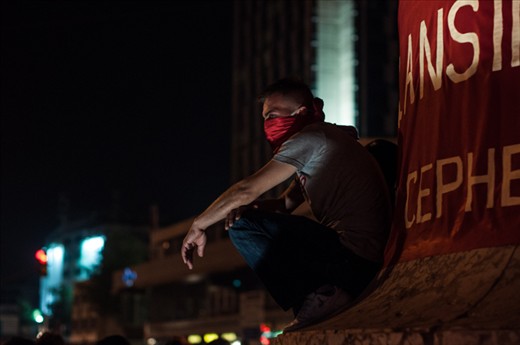 Coverad man trys to don't breed the tear gas