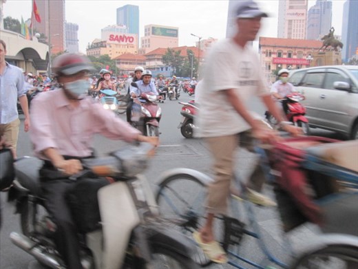 Every mode of Vietnamese transport comes at you, as you try crossing the roads. Motor bikes, scooters, bicycles weave between pedestrians....