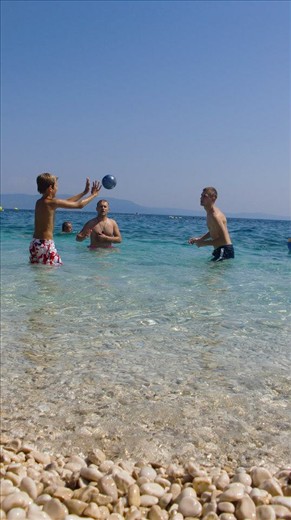 Boys playing. I wanted to capture a shot that would contain everything from the gravel to the sky. The whole place was crystal clear, and so is the shot. Not busy, but simple instead.
